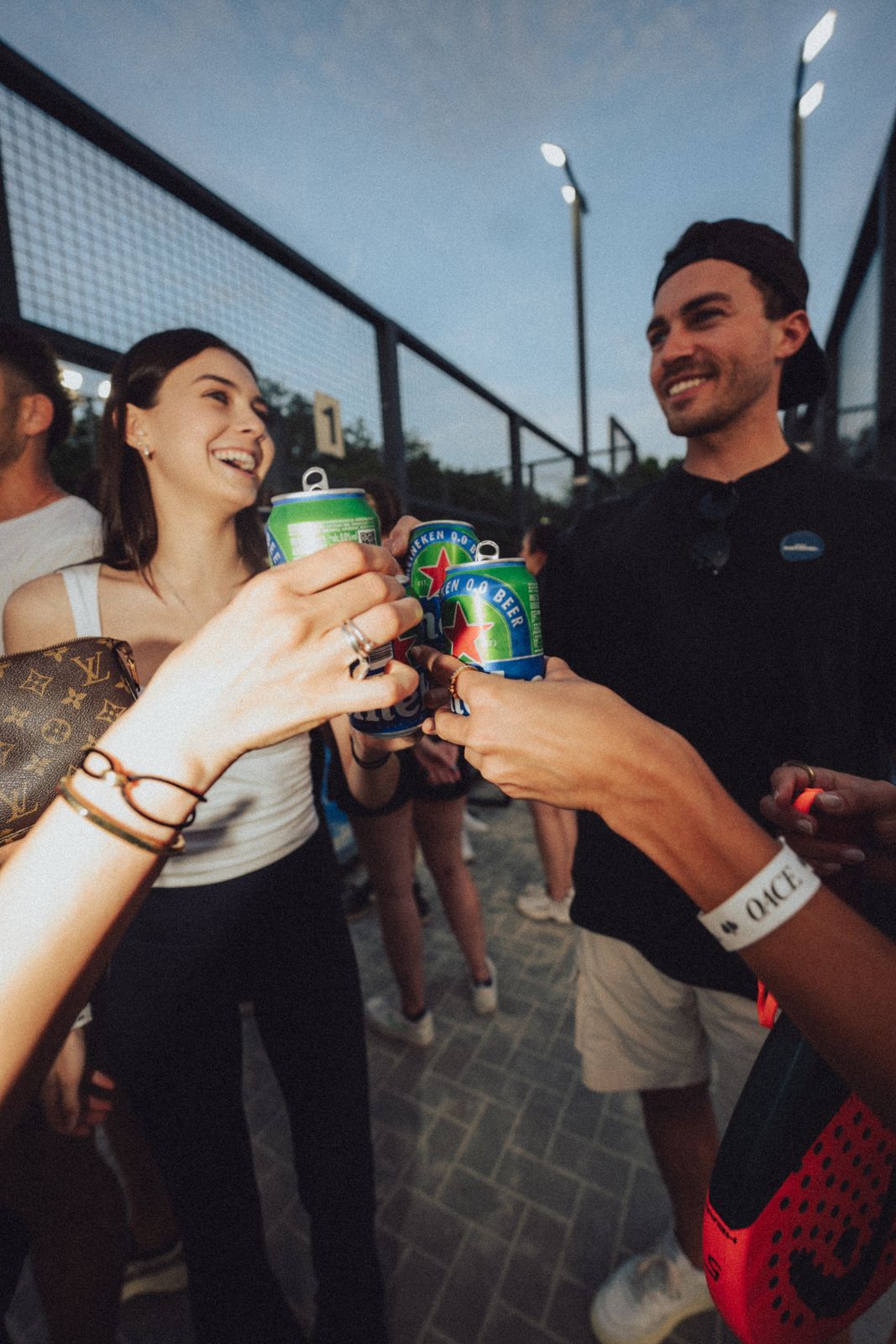 Group toasting with Heineken 0.0 cans at the Frankfurt edition