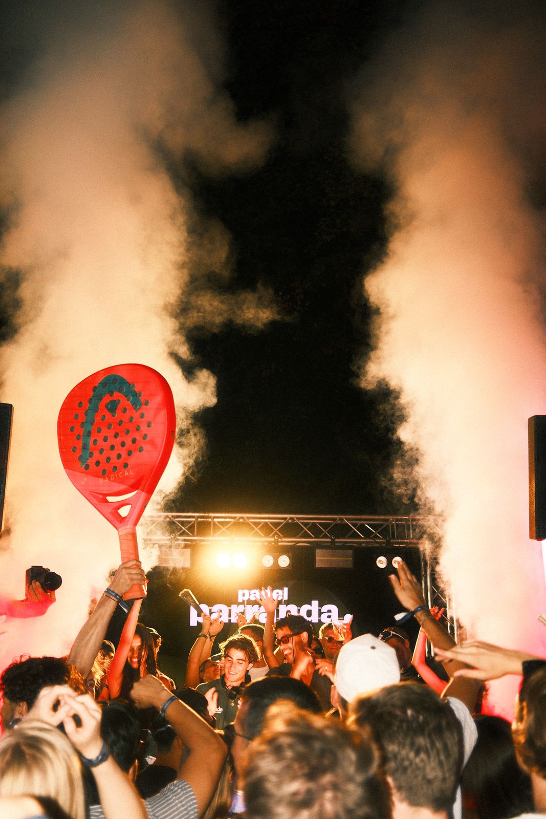 DJ set with smoke in Munich, racquet raised